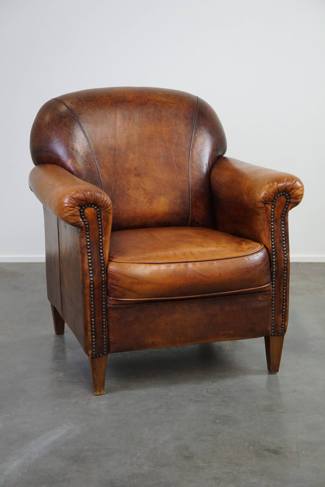 Beautiful sheep leather armchair with fixed cushion and stunning colors