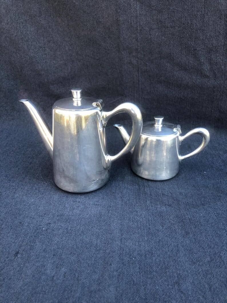 A pair of vintage silver-plated teapot and coffee pot