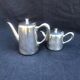 A pair of vintage silver-plated teapot and coffee pot