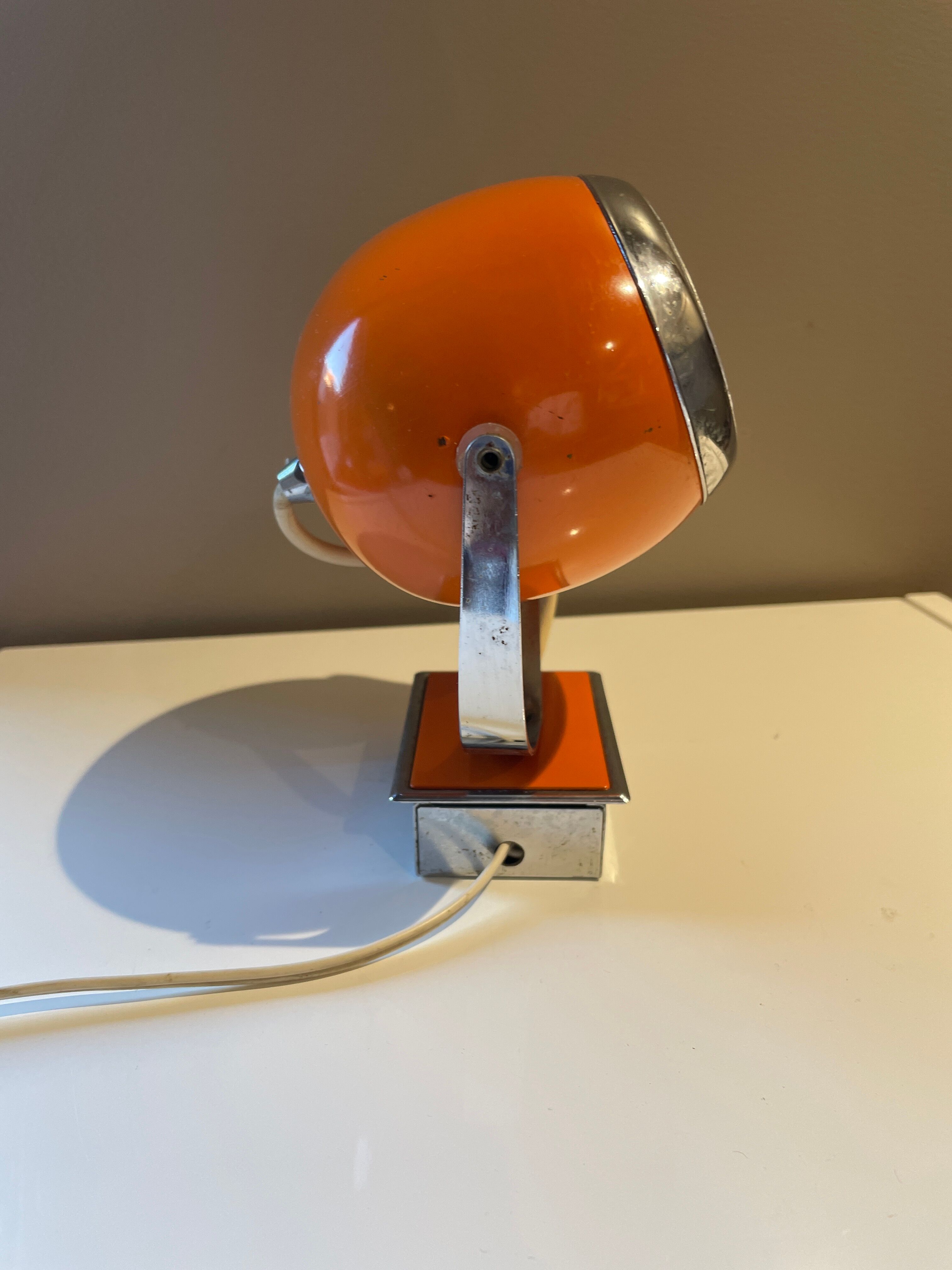 Orange eye ball wall lamp
