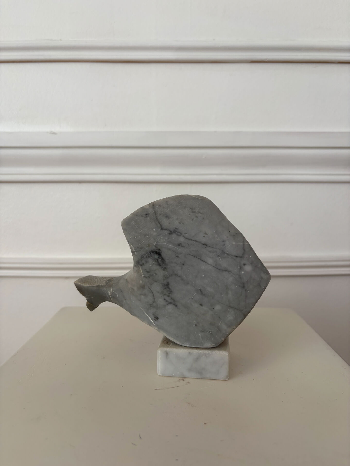 Marble sculpture in the shape of a fish.
