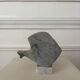 Marble sculpture in the shape of a fish.