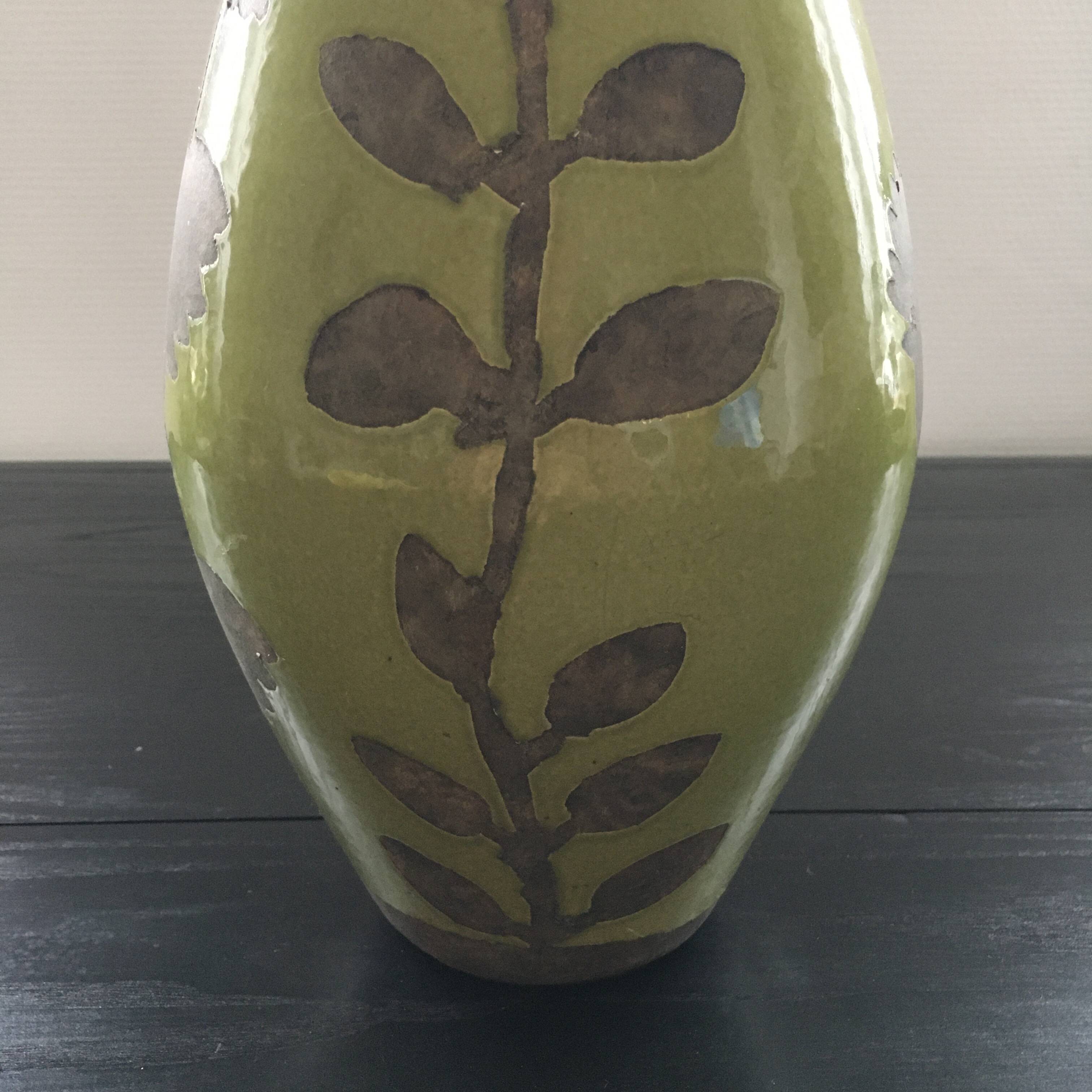 Large green vase with floral decoration