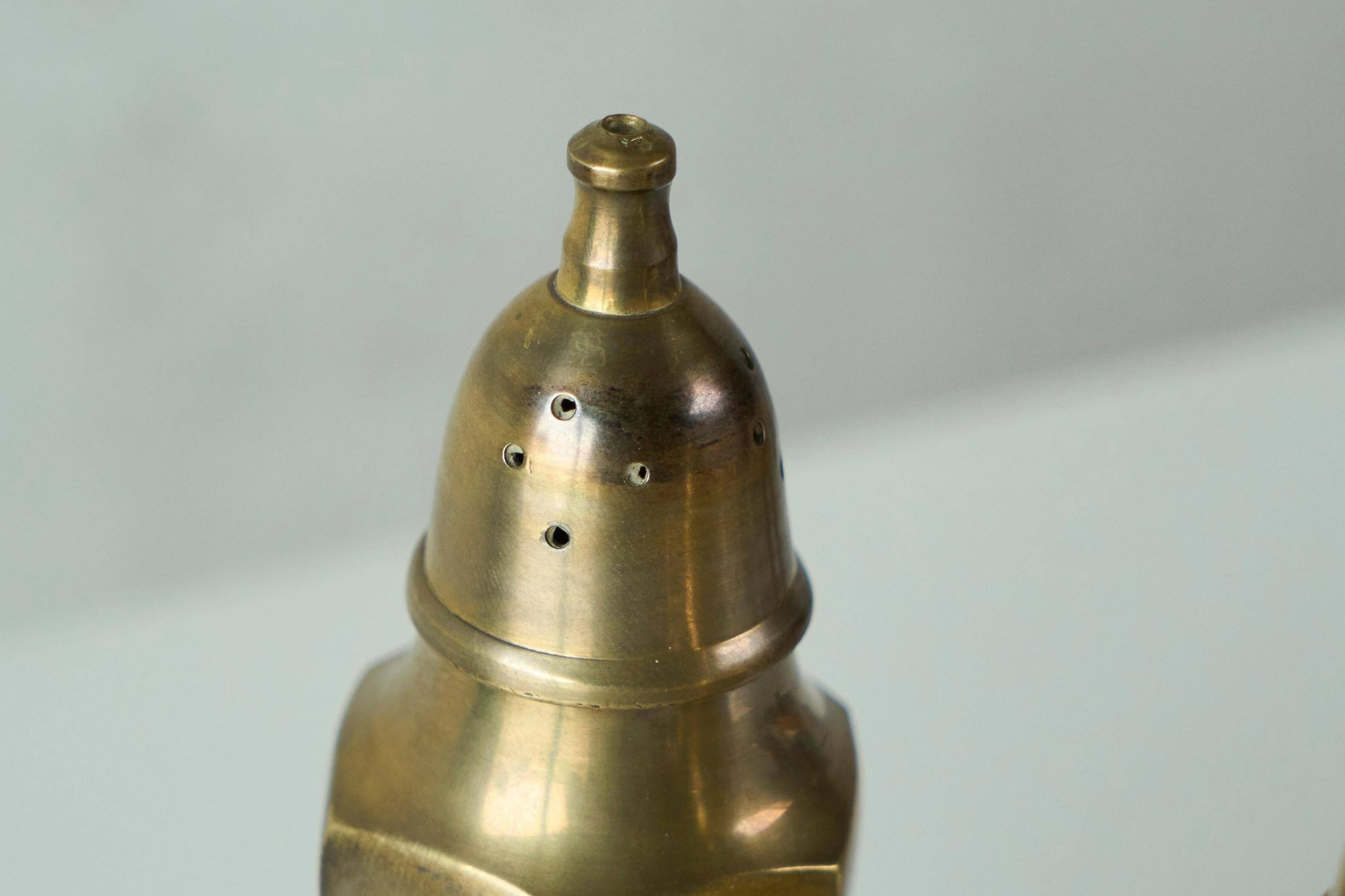 Pair of patinated brass salt and pepper shakers, 20th century.