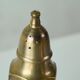 Pair of patinated brass salt and pepper shakers, 20th century.