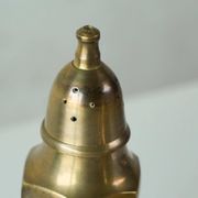 Pair of patinated brass salt and pepper shakers, 20th century.