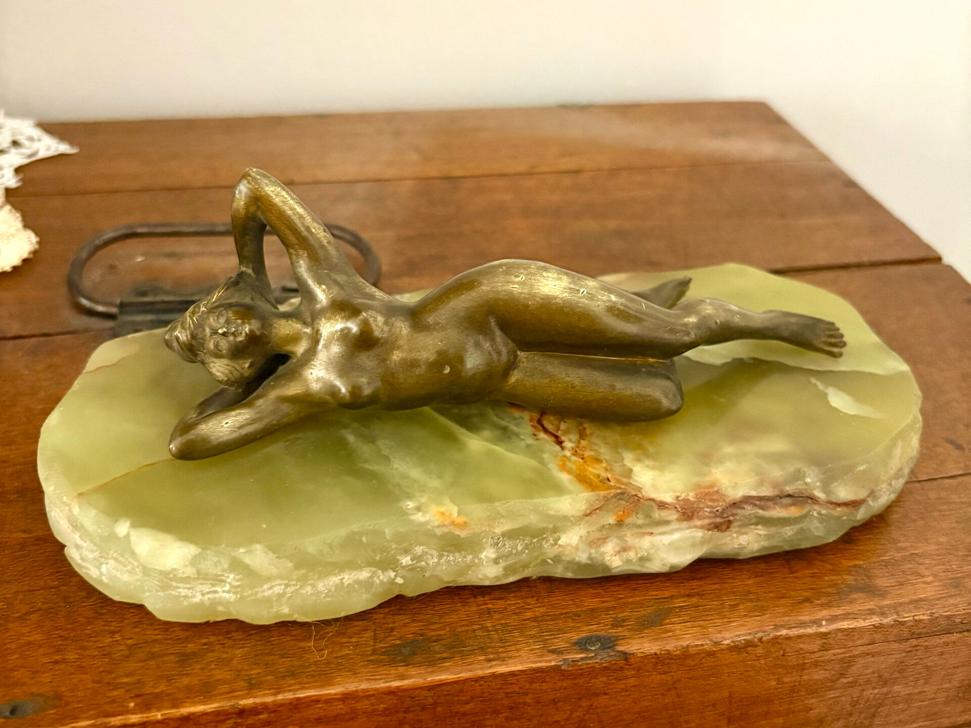Art Deco female sculpture in bronze with onyx base.