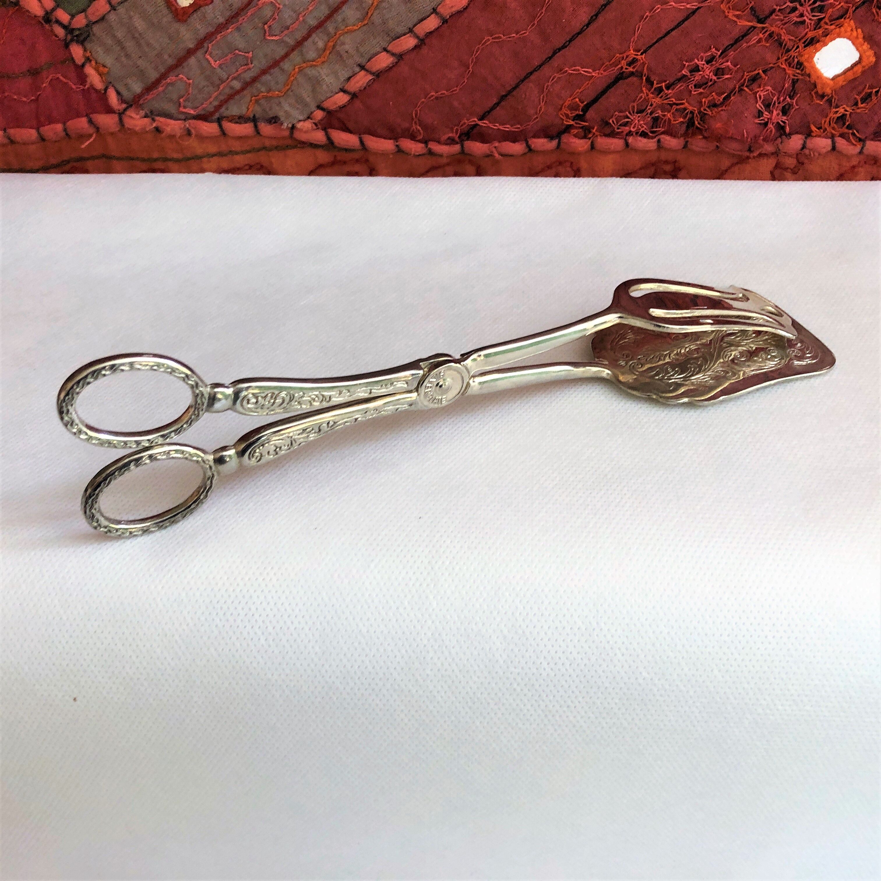 Wrought silver plated cake clips