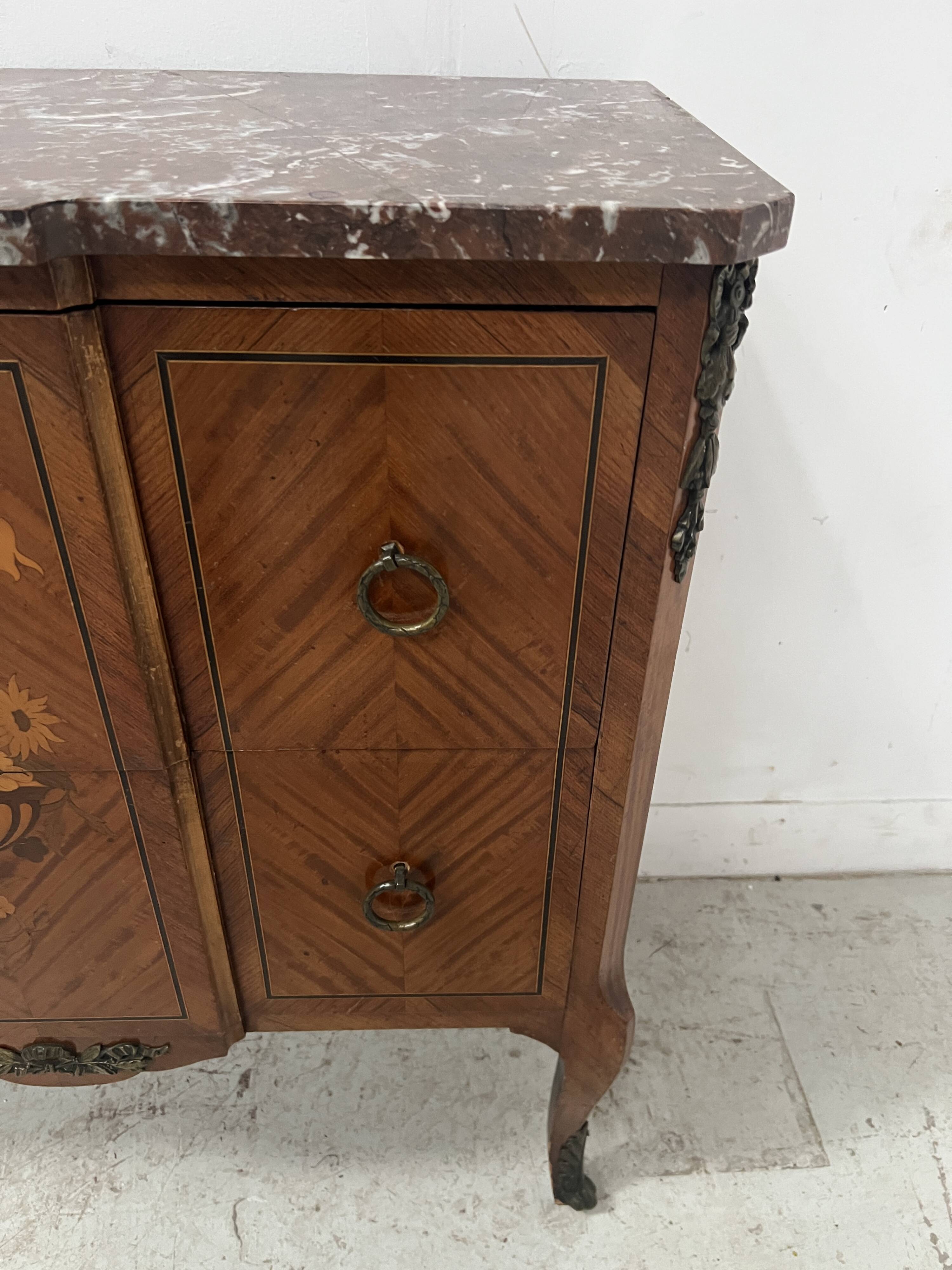 Transitional style commode with a protruding front, in marquetry wood, 20th century.