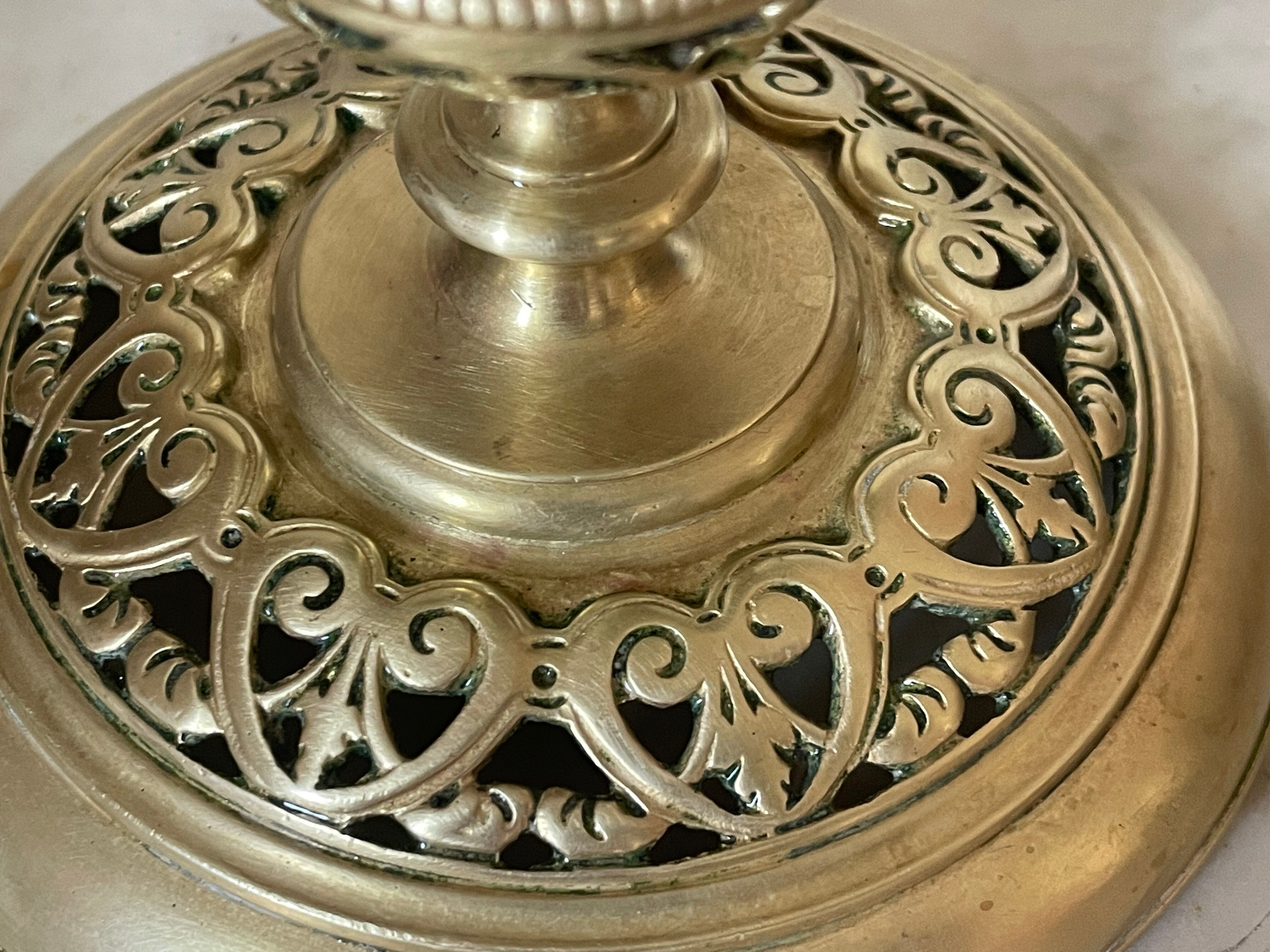 pair of openwork gilded brass candlesticks from the 19th century