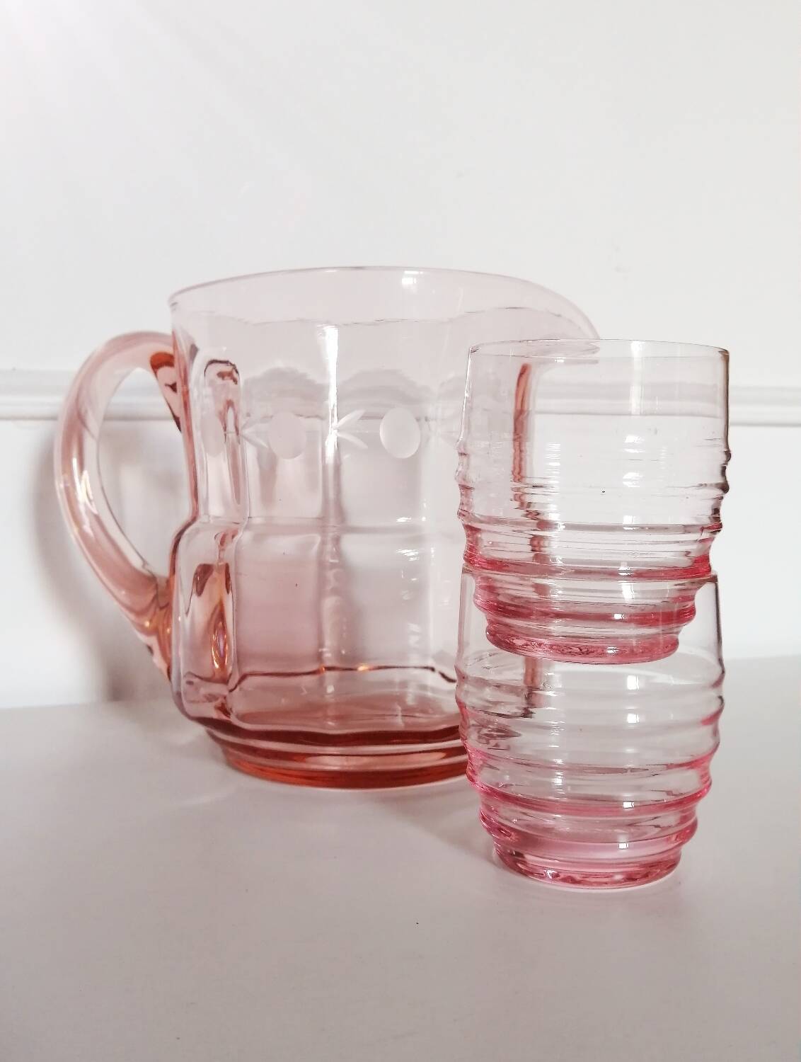 Pitcher and 2 glasses in pink glass