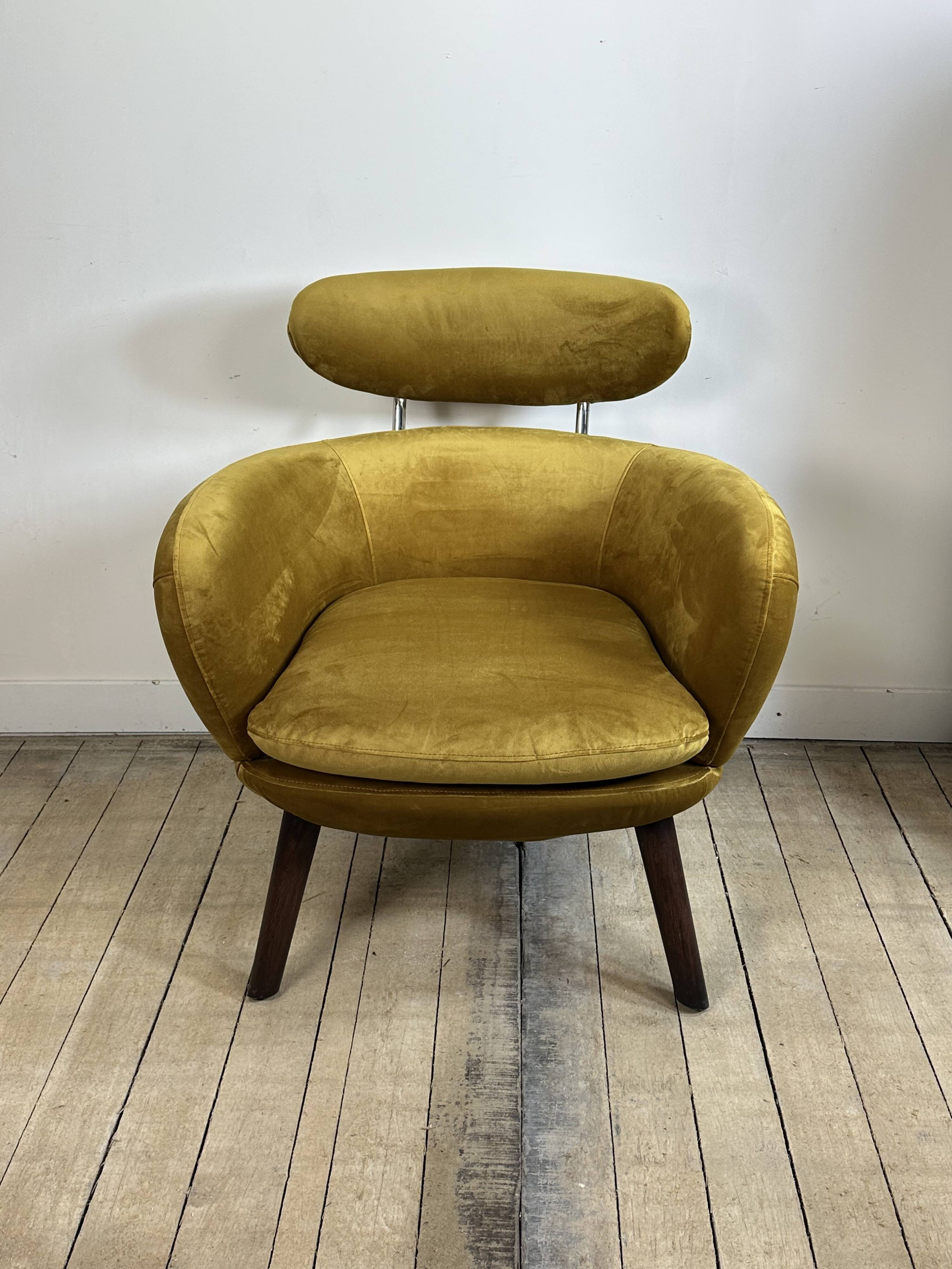 Mustard yellow velvet armchair from the 2010s.