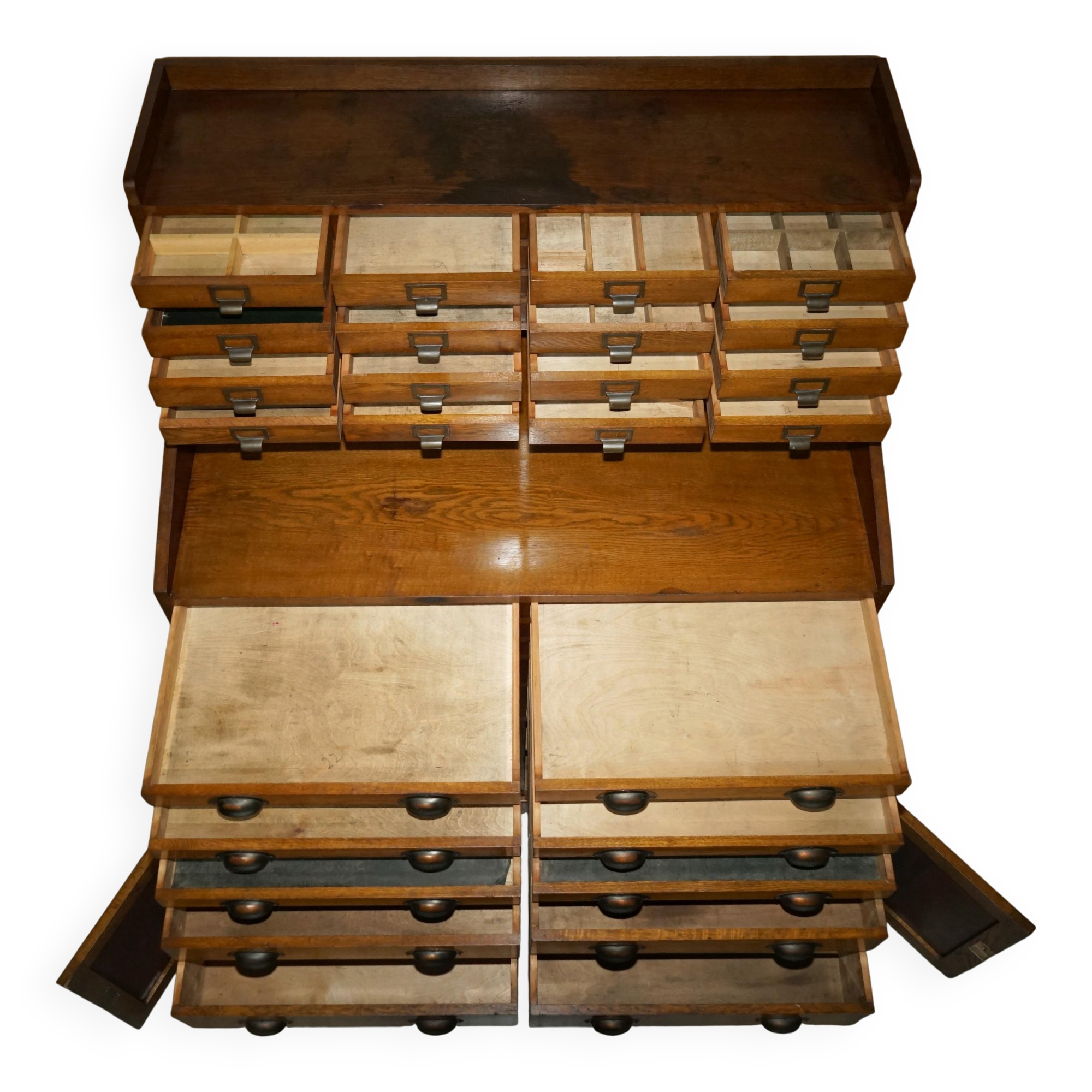 Antique English Art Deco furniture in hand-carved oak, 26 drawers.