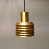 Hanging lamp in gold-colored aluminum with many layers of shades.