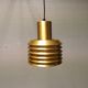 Hanging lamp in gold-colored aluminum with many layers of shades.