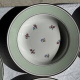 Set of 9 vintage turquoise deep plates with gold trim and pink flowers.