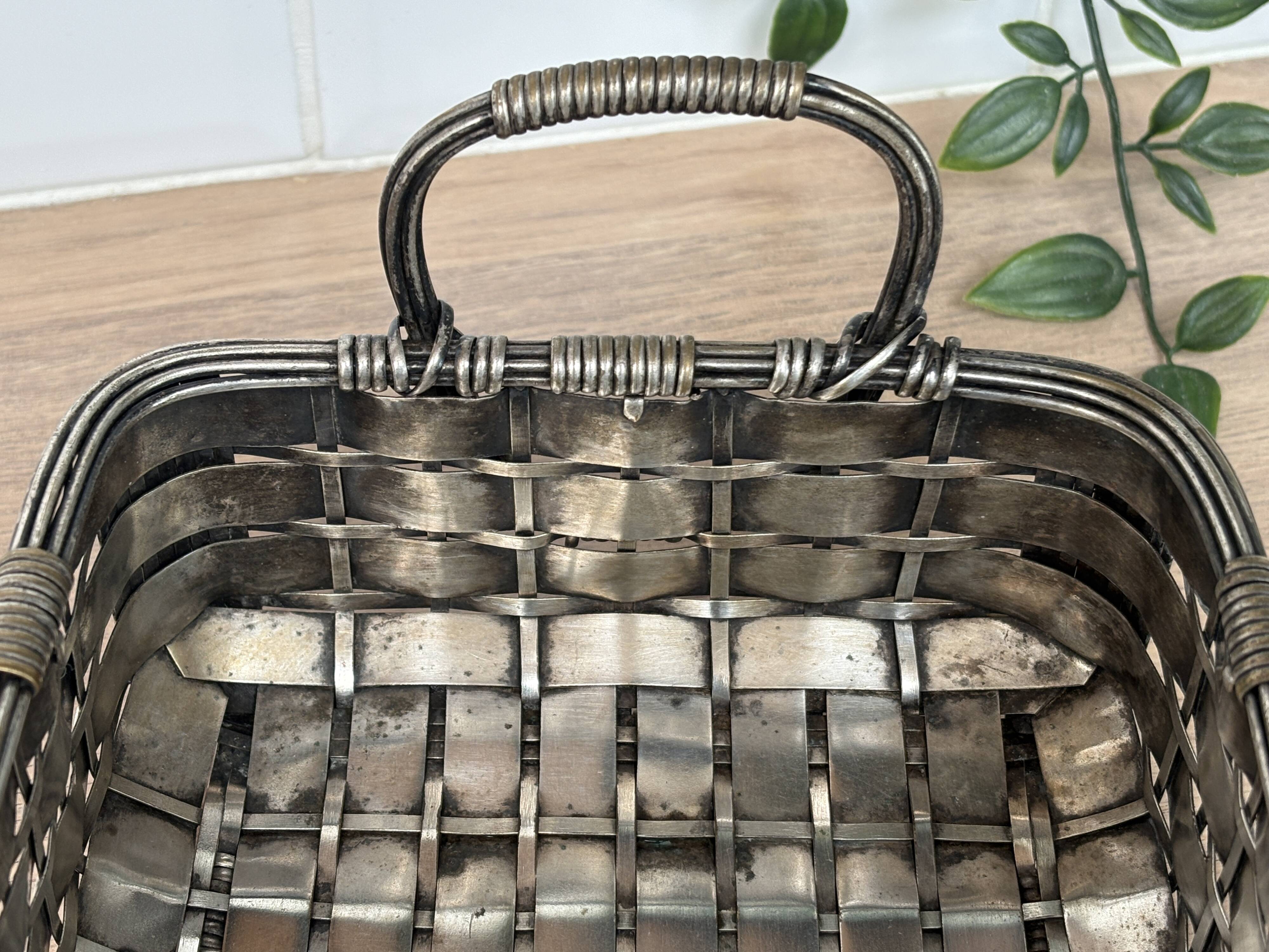 Woven silver-plated metal basket.