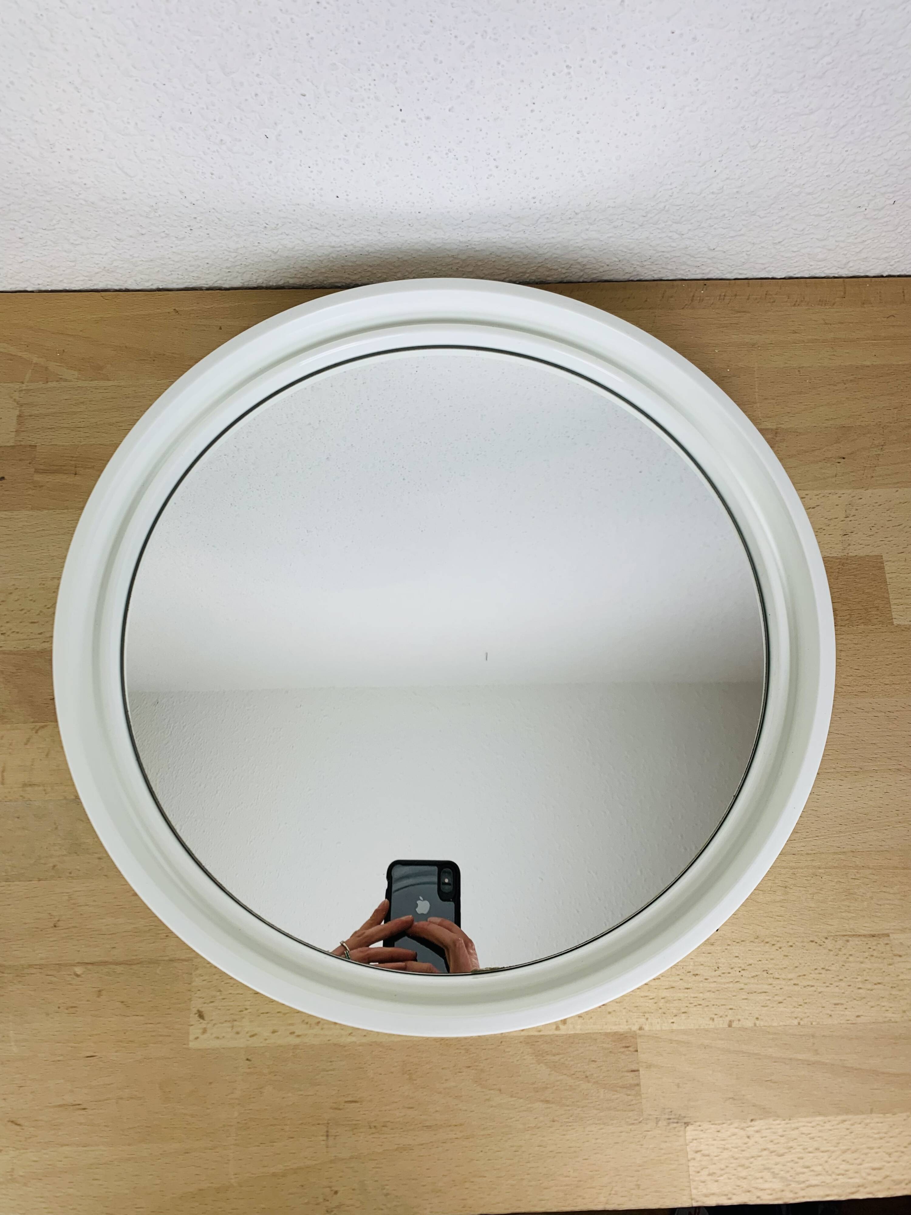 Space age mirror with white frame from the 1970s.