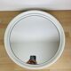 Space age mirror with white frame from the 1970s.