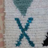 White Boucherouite Moroccan Berber rug with colorful patterns