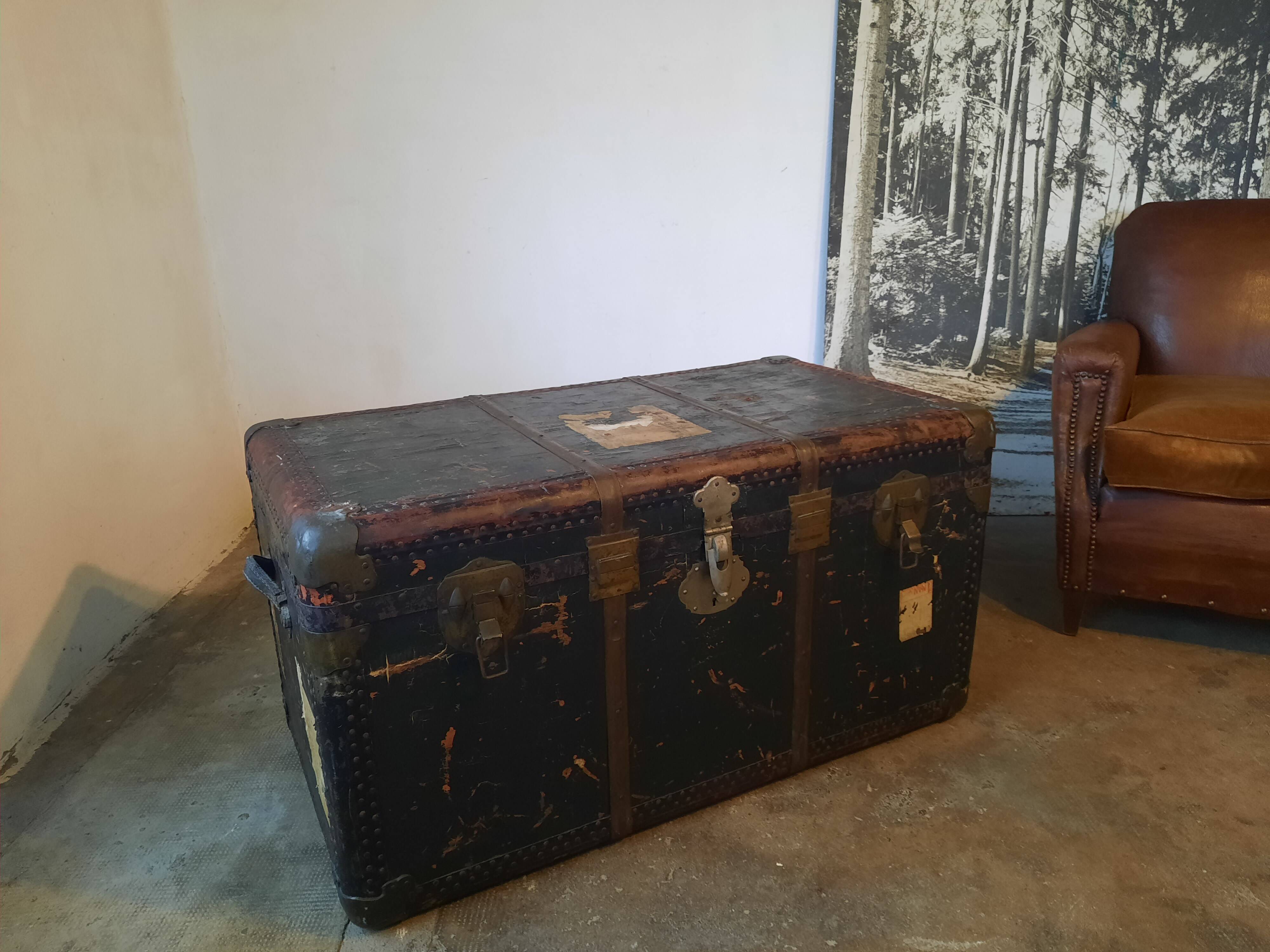 Old and large travel trunk, brass-plated corners