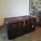 Old and large travel trunk, brass-plated corners