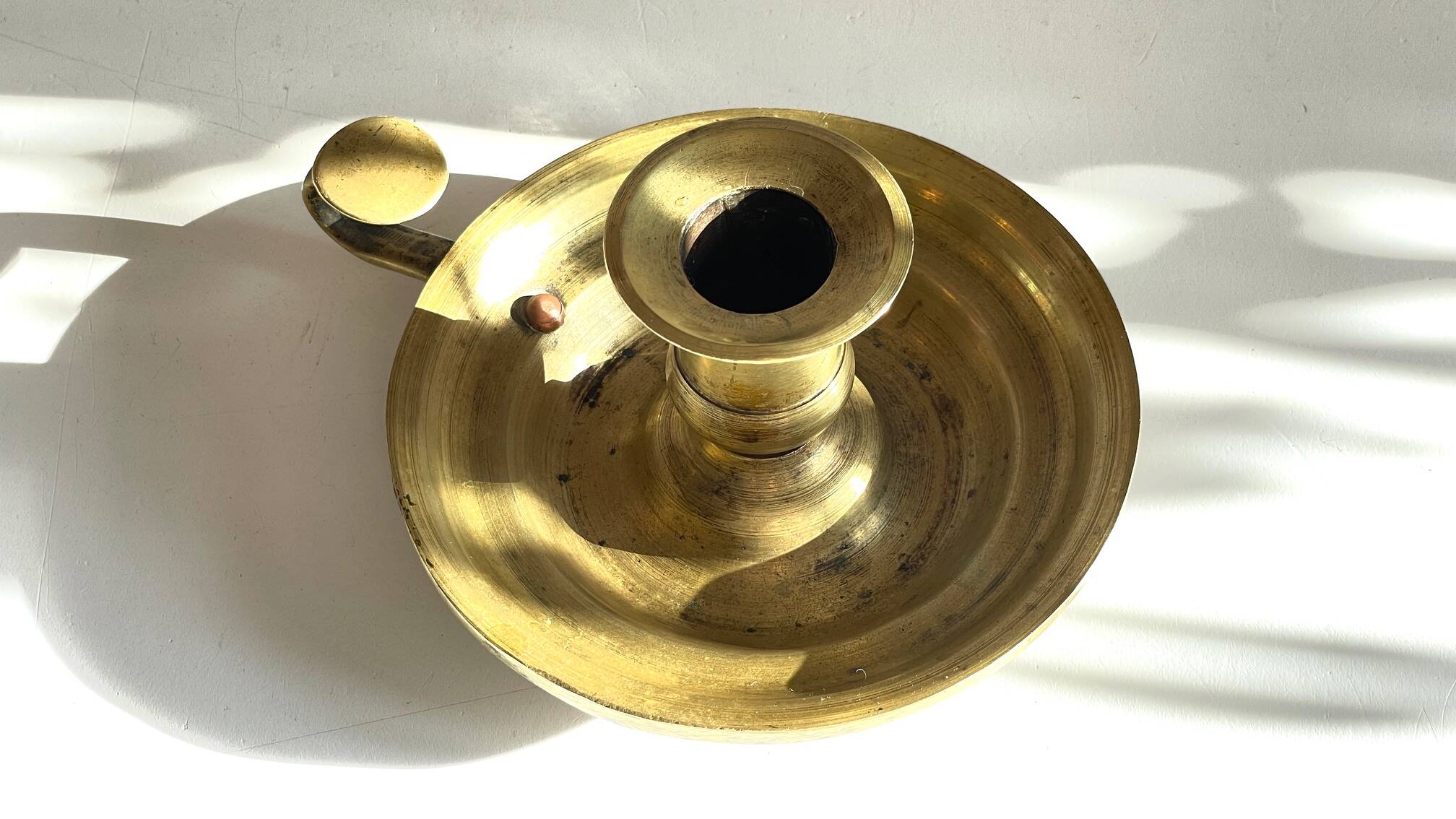 Antique solid bronze hand candlestick