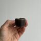 Set of 5 dark brown glazed ceramic egg cups.