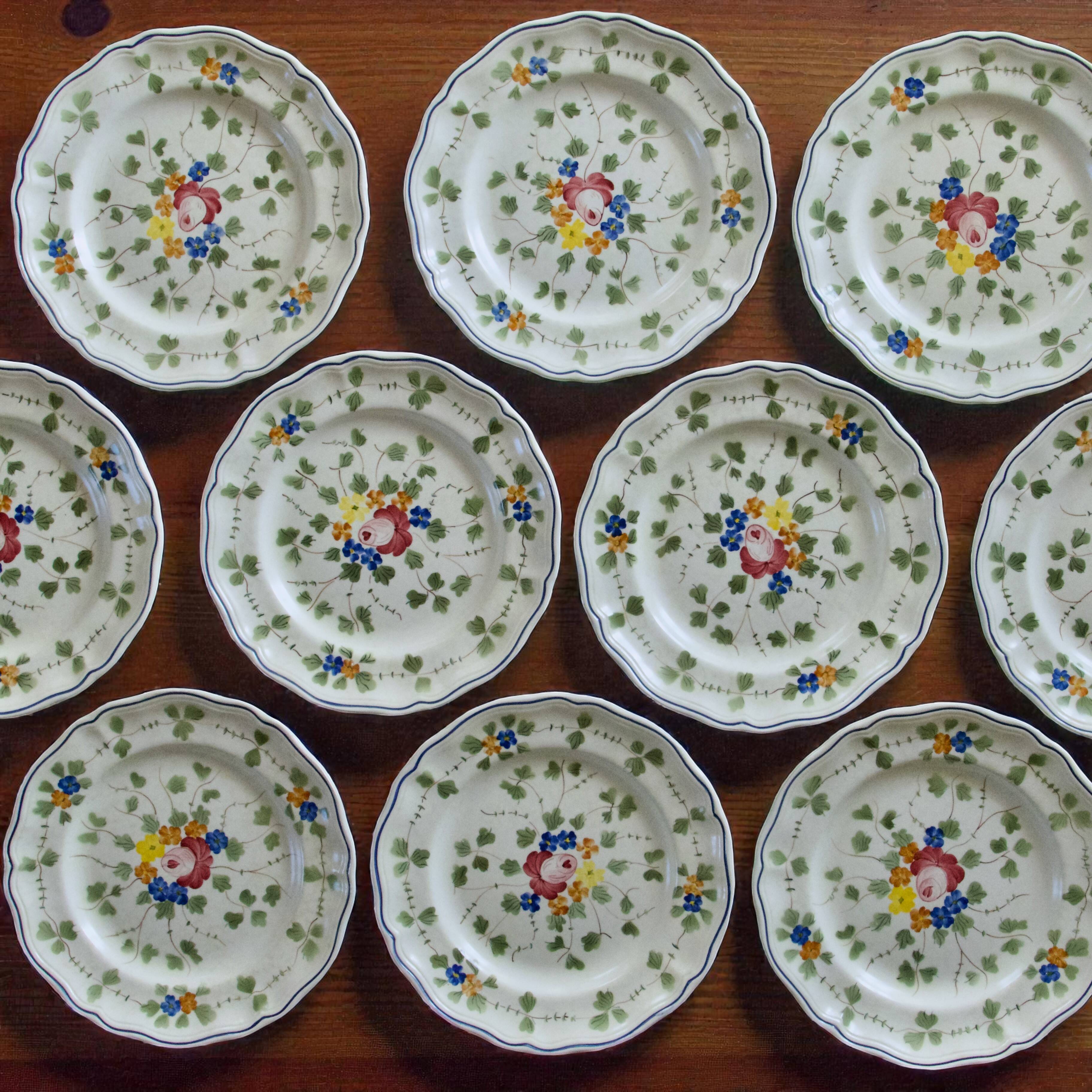 10 flat plates from the Longchamp "Nemours" collection, hand-painted.