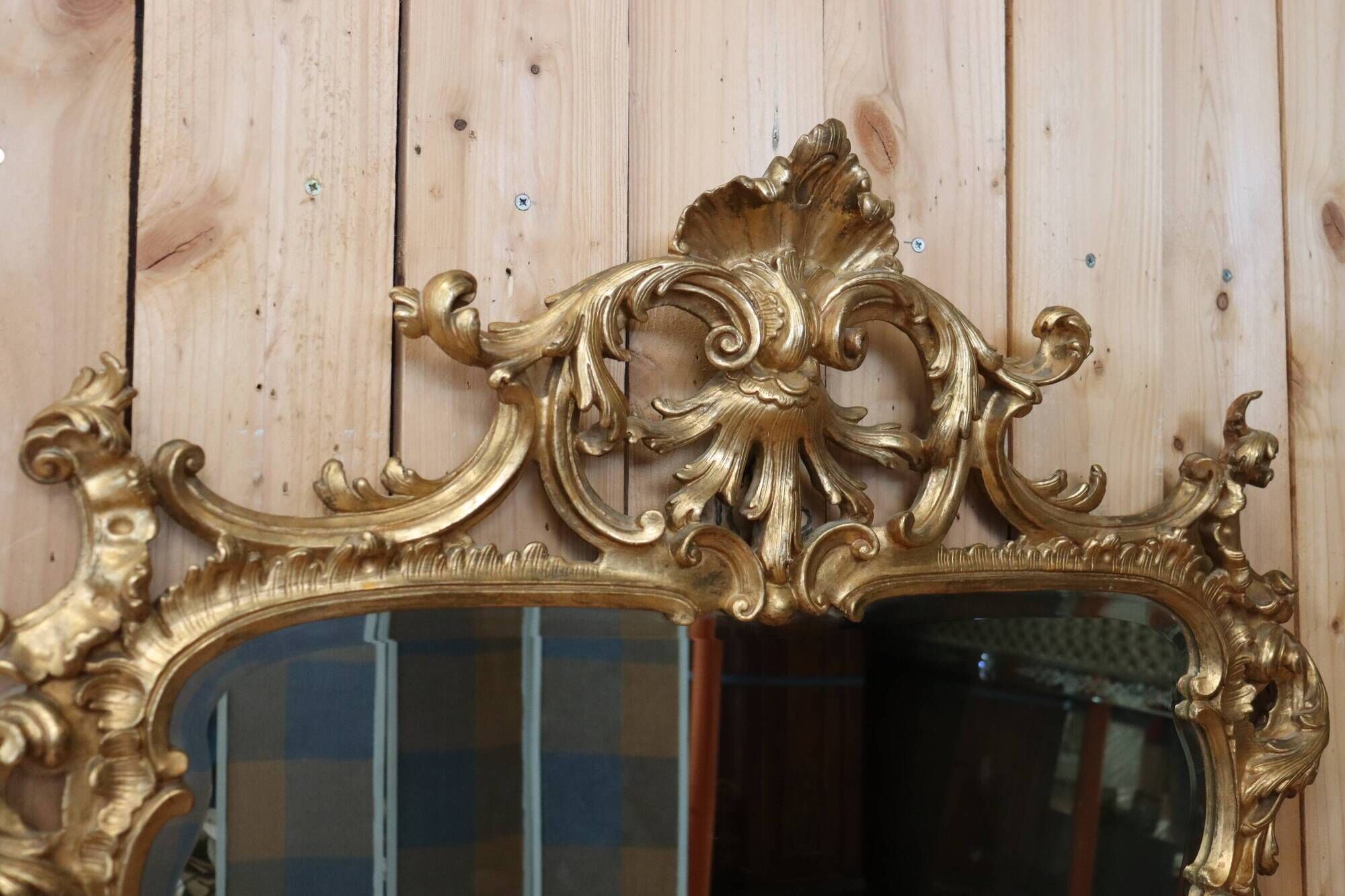 Golden wooden mirror in Louis XV style