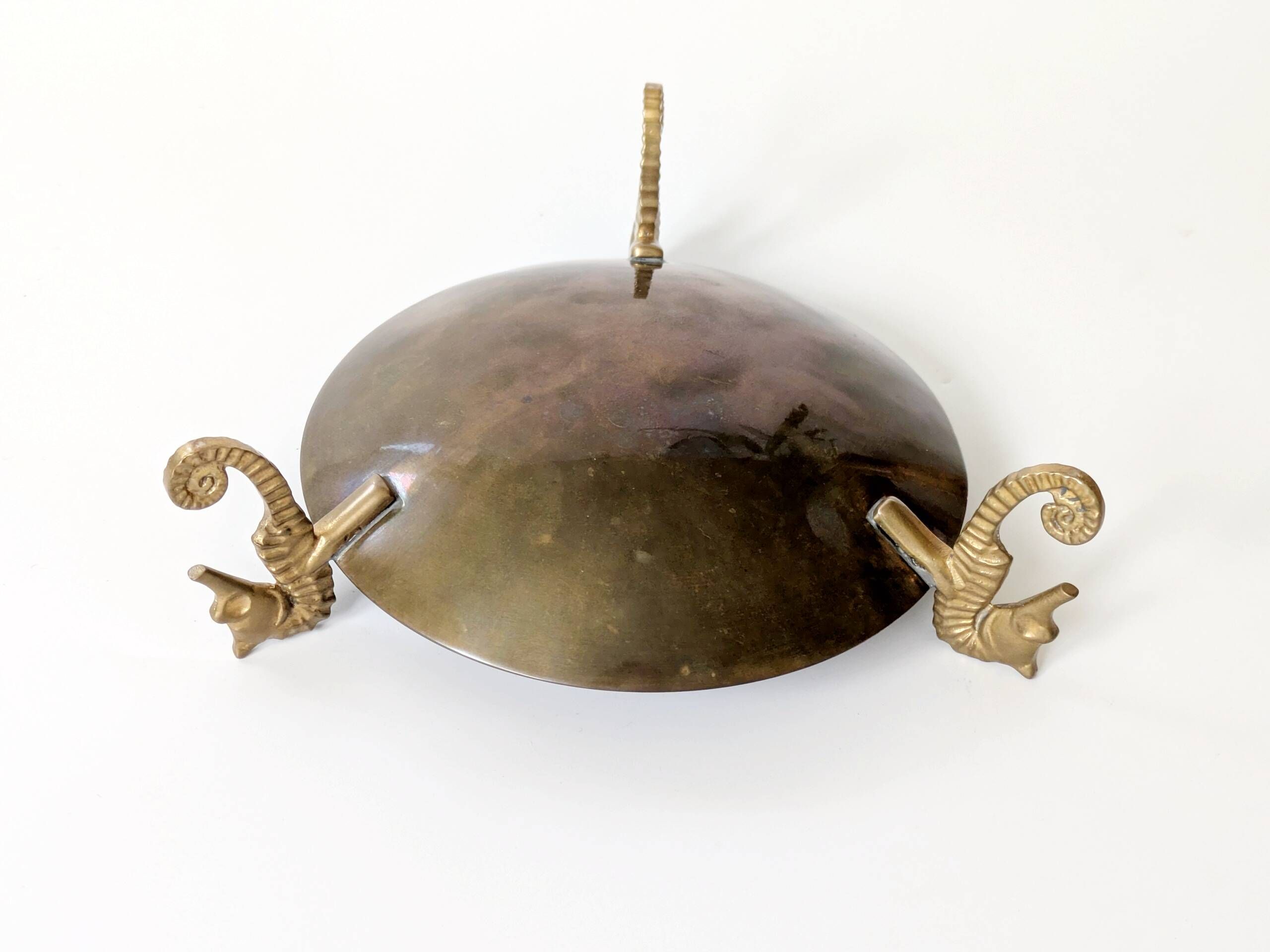 Vintage round brass tray on seahorse feet
