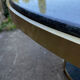 Round dining table with green marble and solid brass.