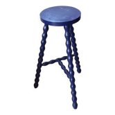 Vintage tripod stool made of turned wood, painted blue.