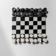 Vintage black-and-white marble chessboard with matching marble pieces, Italian 1960s design, sculptural centerpiece