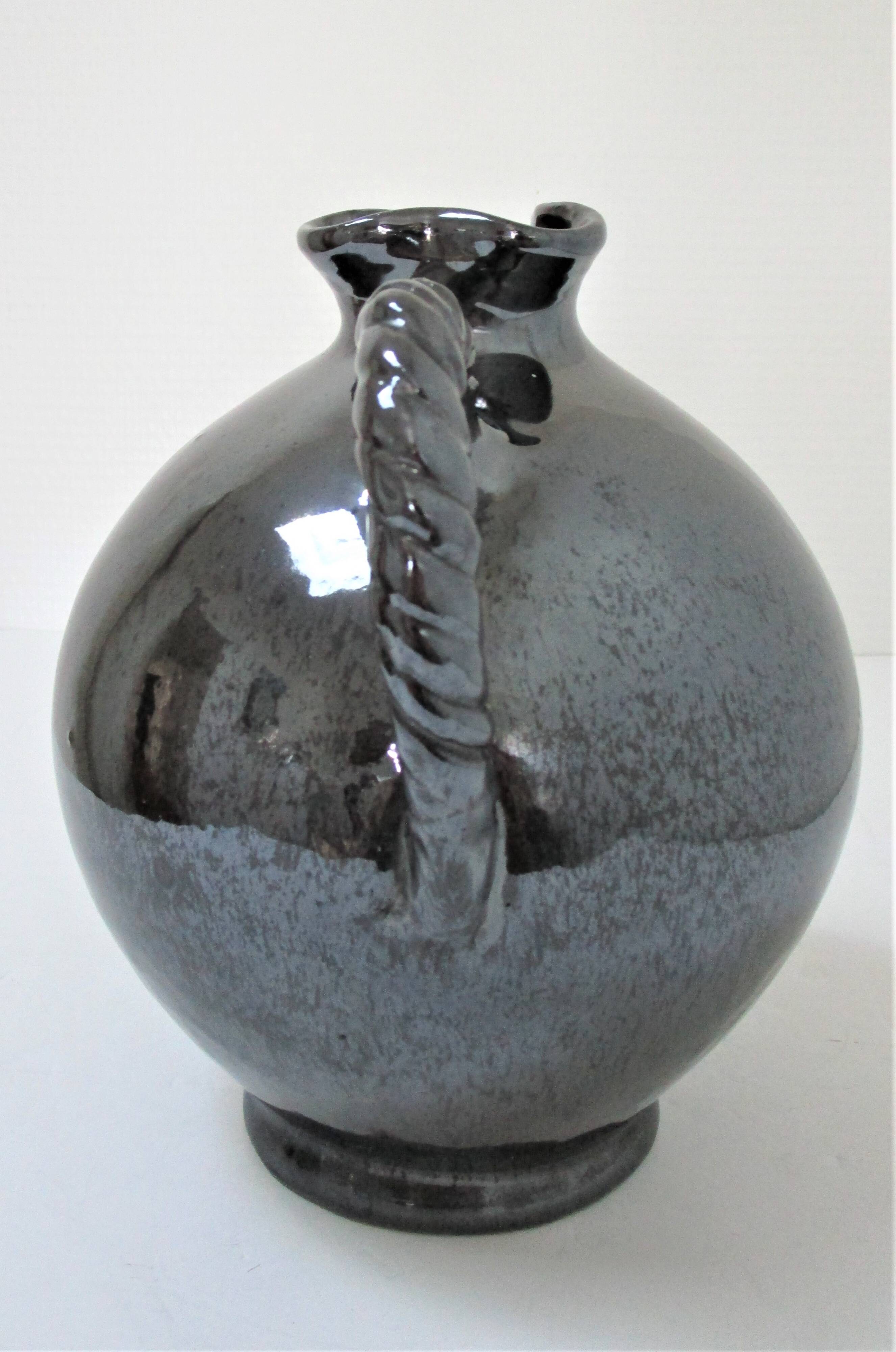 Black pearl glaze ceramic pitcher by Reinhold Rieckmann signed