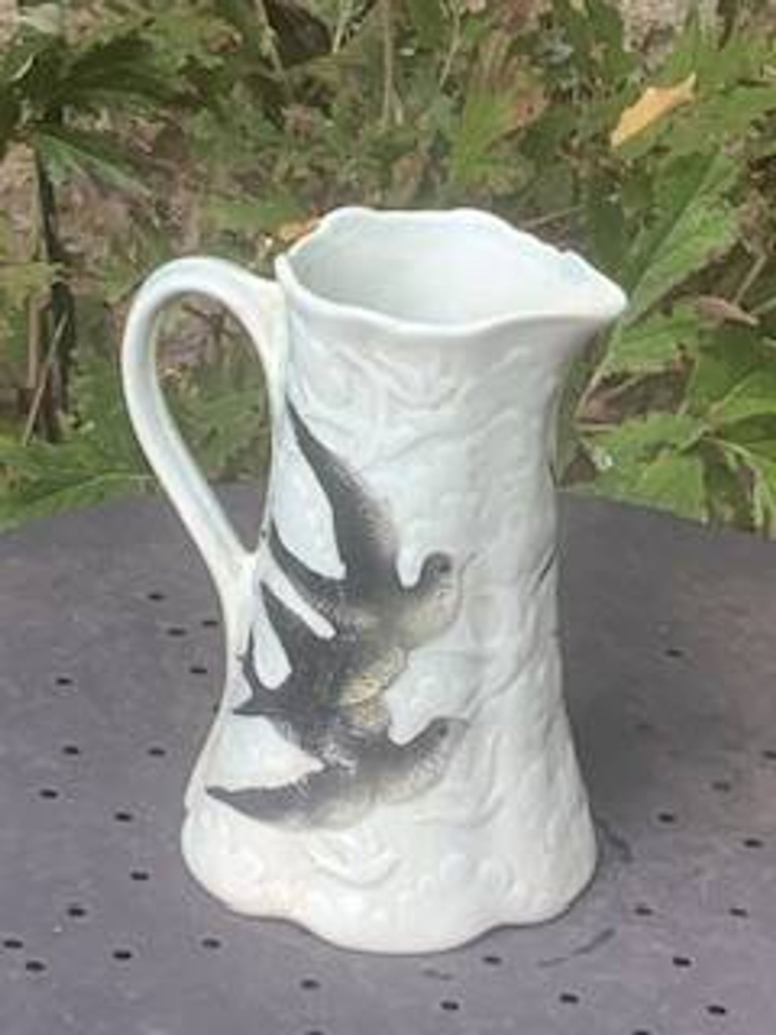Jade green ceramic barbotine vase with swallows.