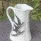 Jade green ceramic barbotine vase with swallows.