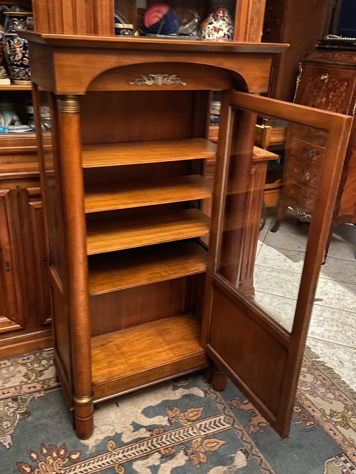 Empire style display case in cherry wood