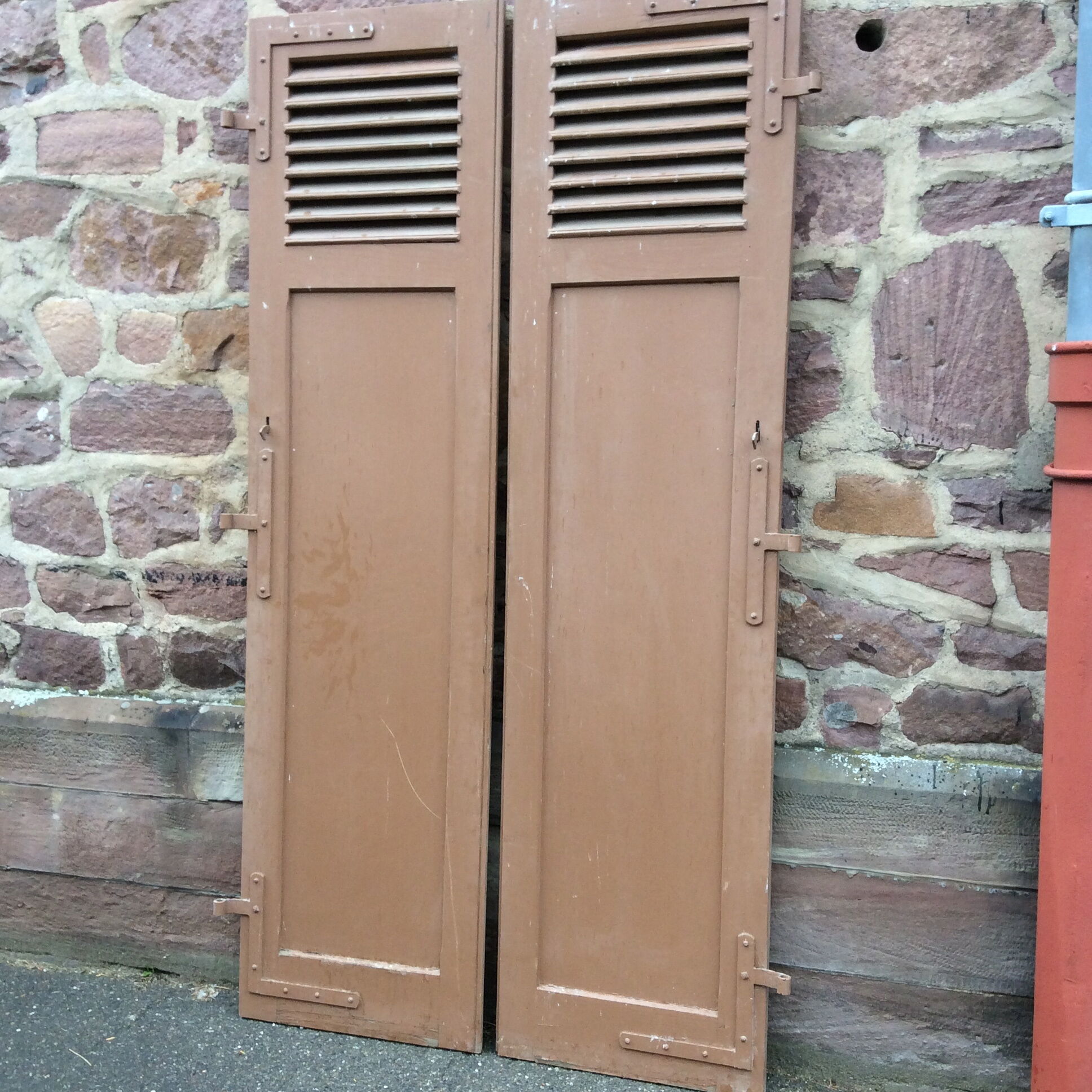Pair of ancient shutters with wrought iron fittings