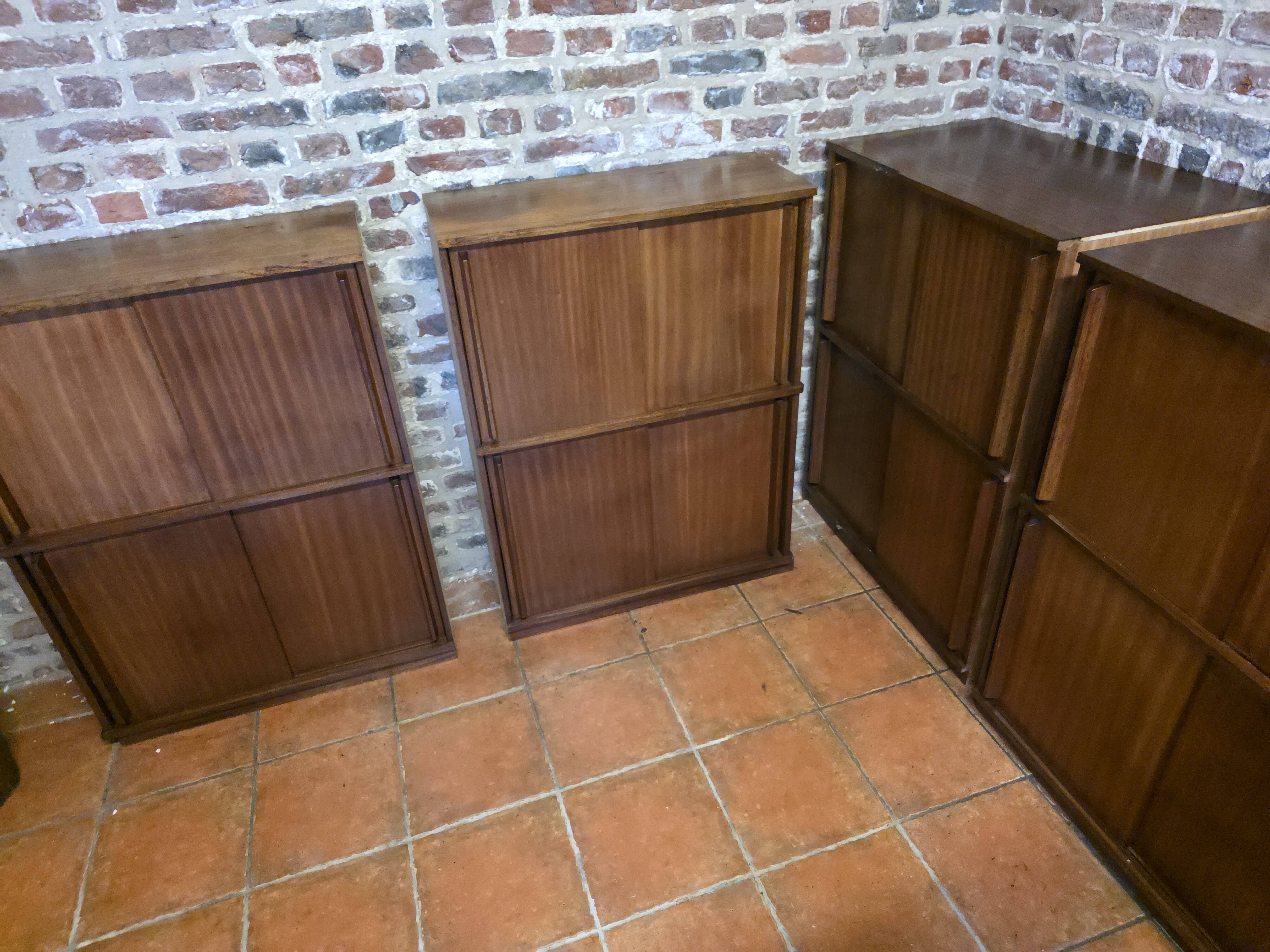 Modular corner library Oscar from the 1960s with sliding doors.