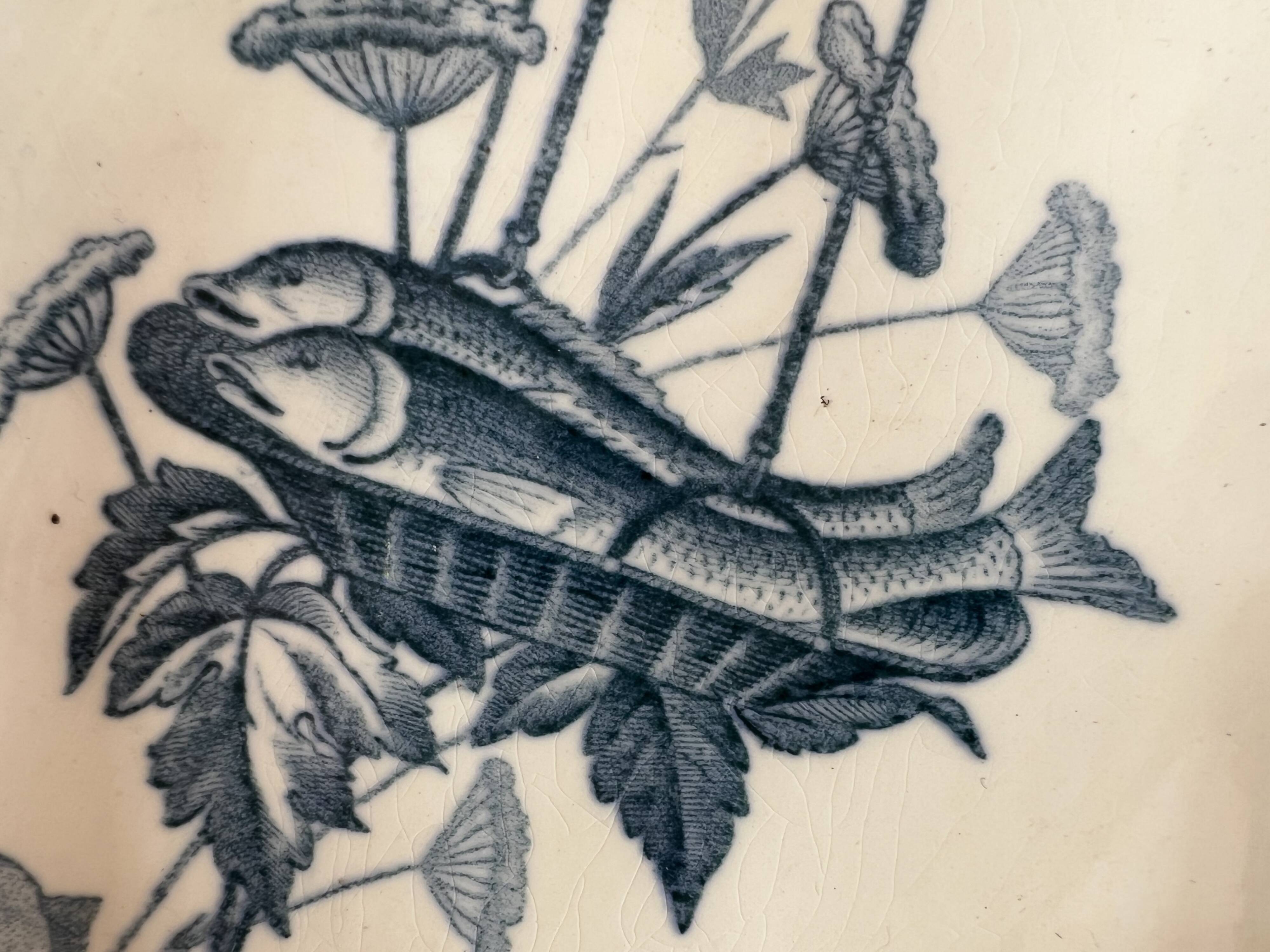 2 Badonviller earthenware dishes with fish decoration, screen model