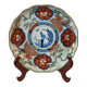 Imari porcelain plate from Japan, 19th century, hand-painted decoration.