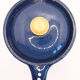 Pitcher and navy blue lid with off-white peas