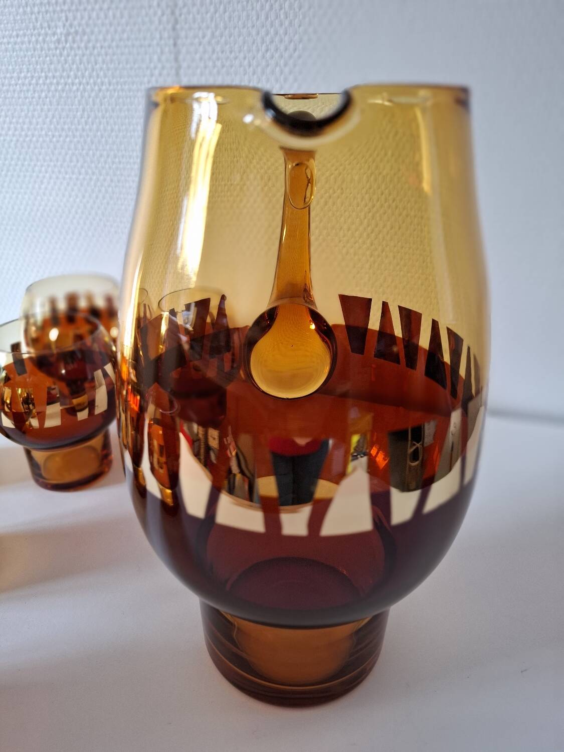 Carafe and its amber/golden glasses from the 70s.