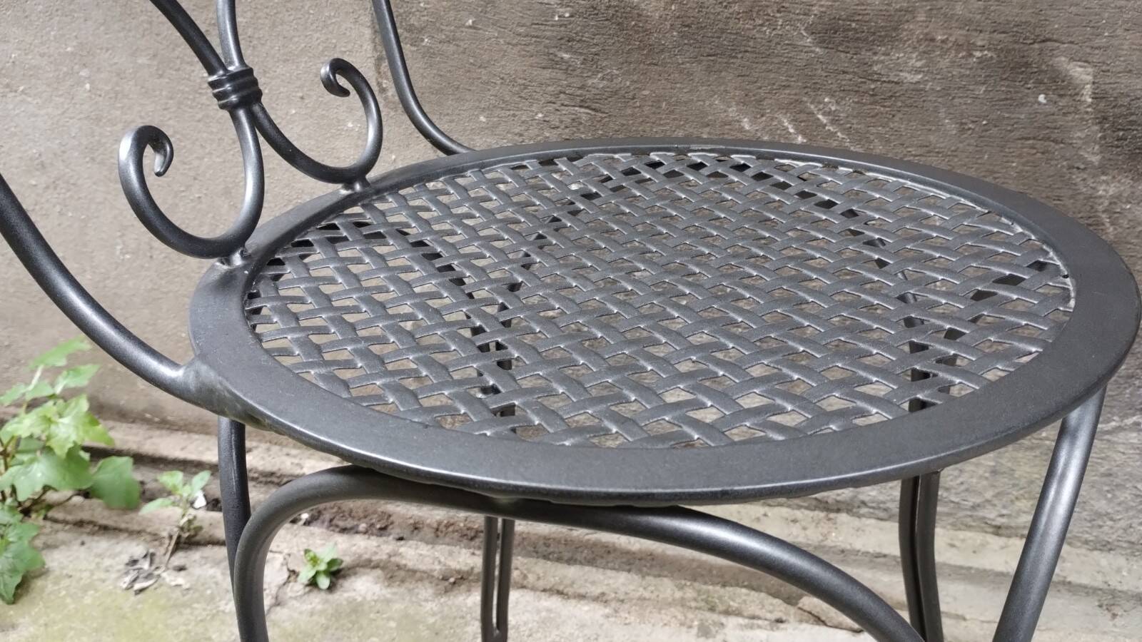 Dark gray wrought iron chair