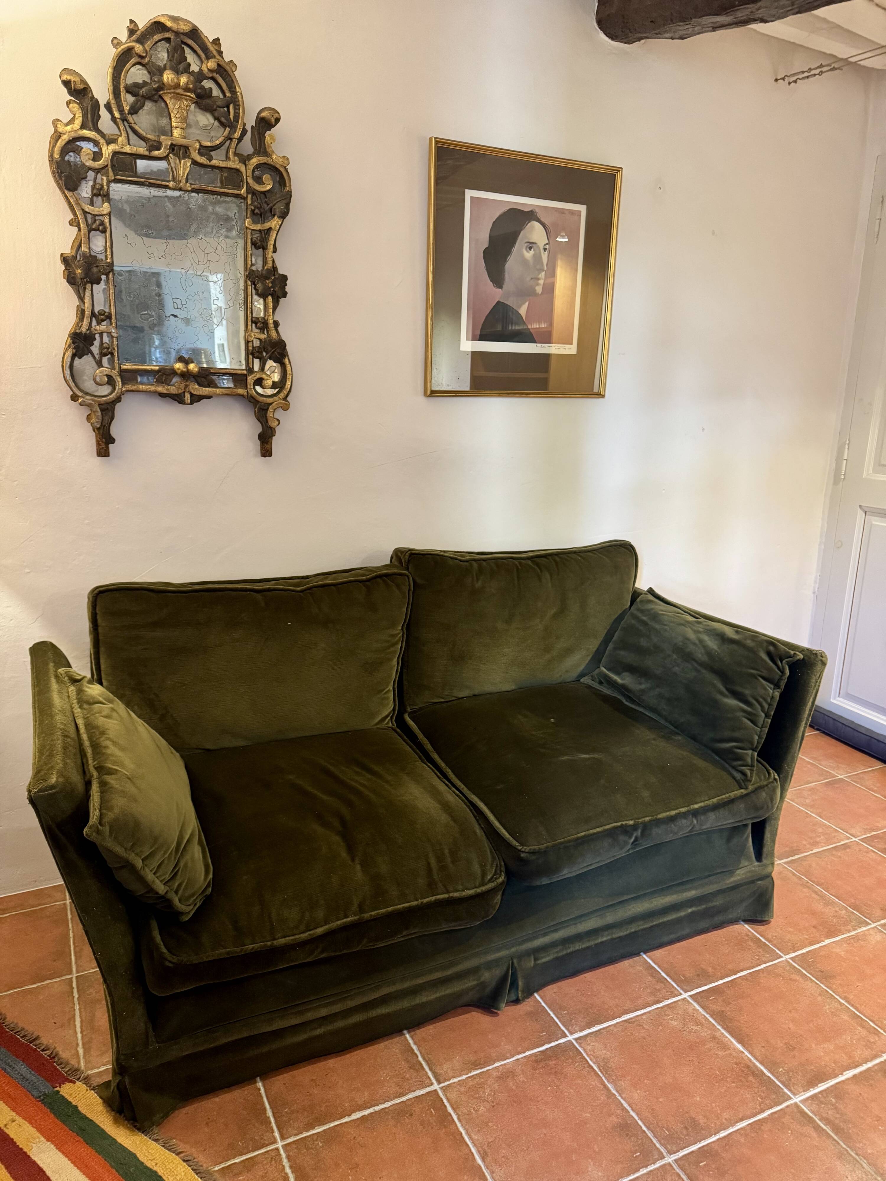 Antique green velvet sofa
