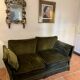 Antique green velvet sofa