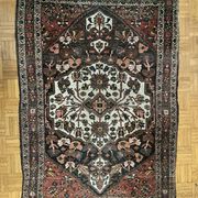 Antique handmade Hamadan Persian rug, ivory medallion on dark background 148x103.