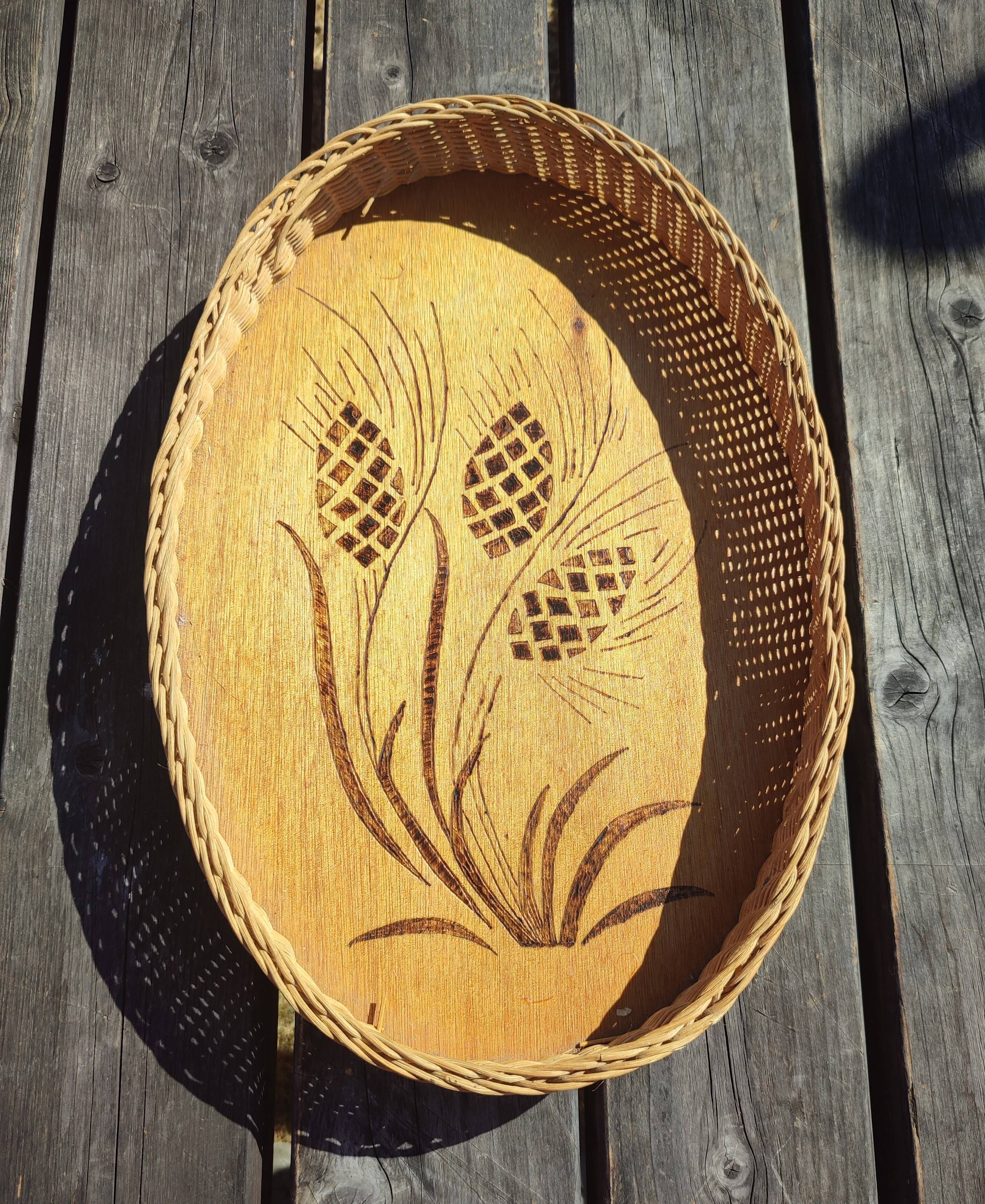 Vintage wall-mounted wicker and pyrographed wood bread basket