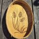 Vintage wall-mounted wicker and pyrographed wood bread basket
